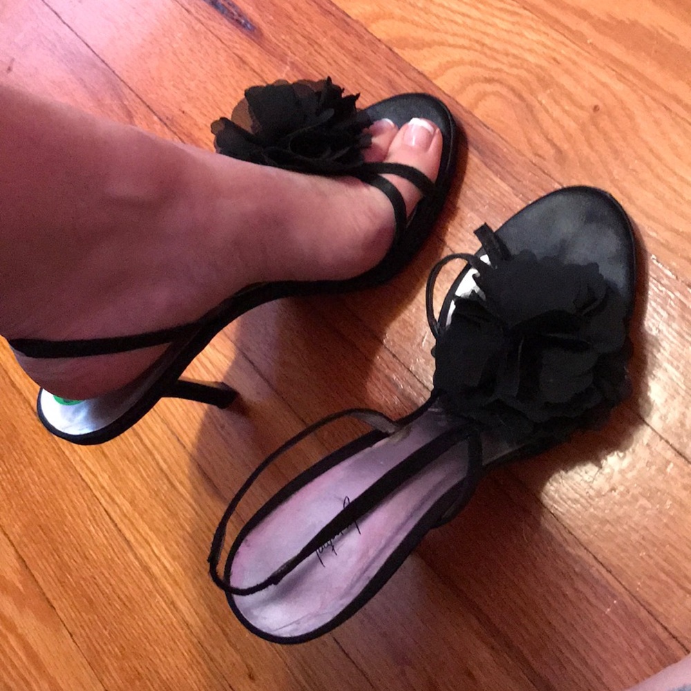 Black heels with flower on top